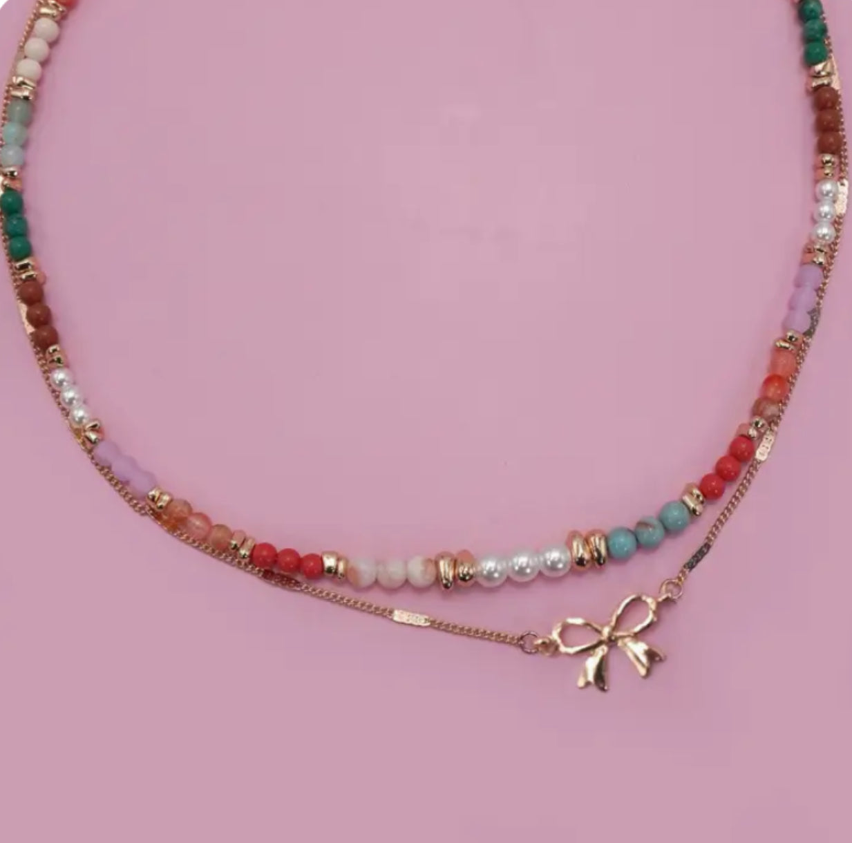 Multi layered beaded bow necklace