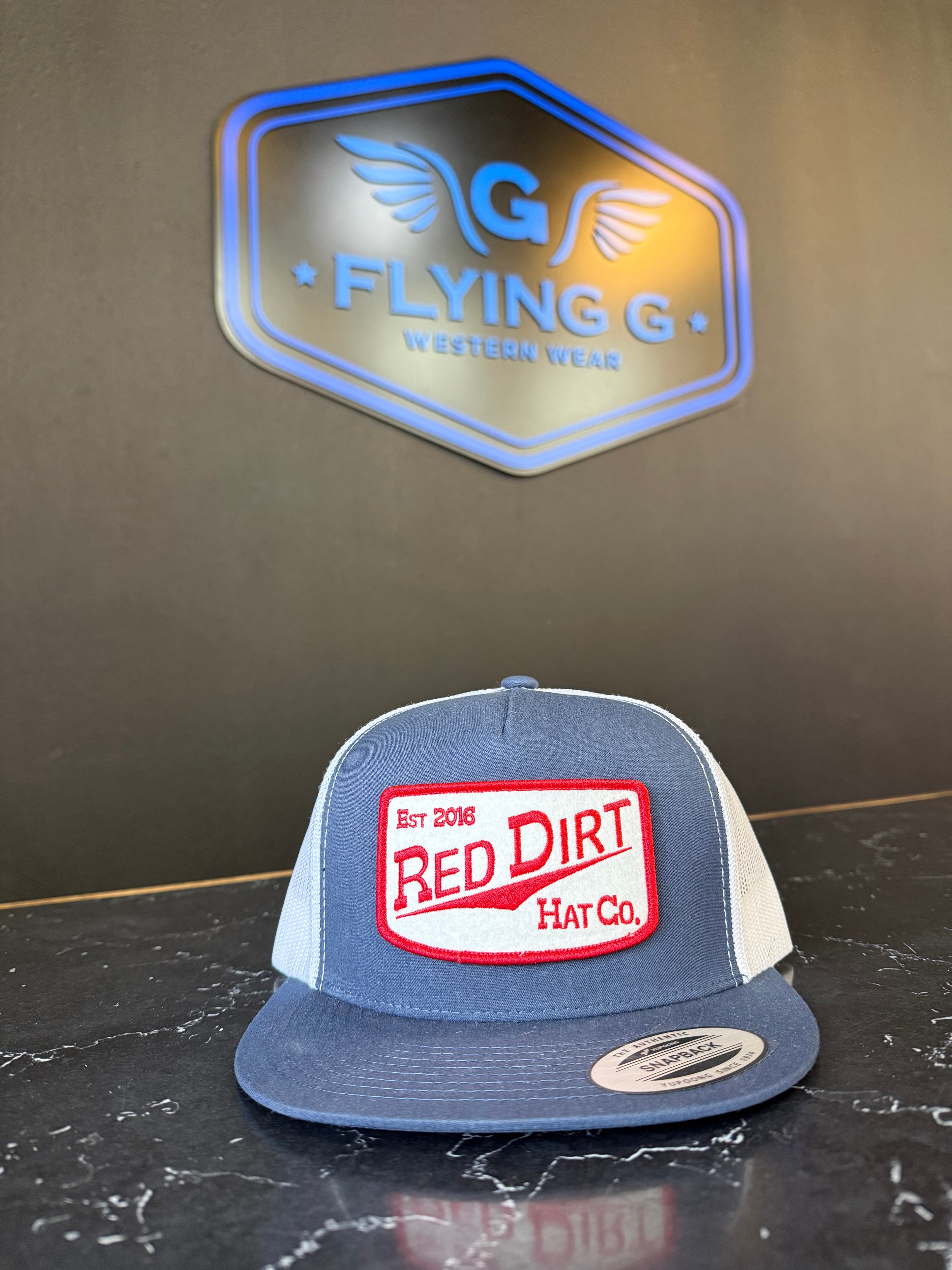 Blue and red red dirt hat
