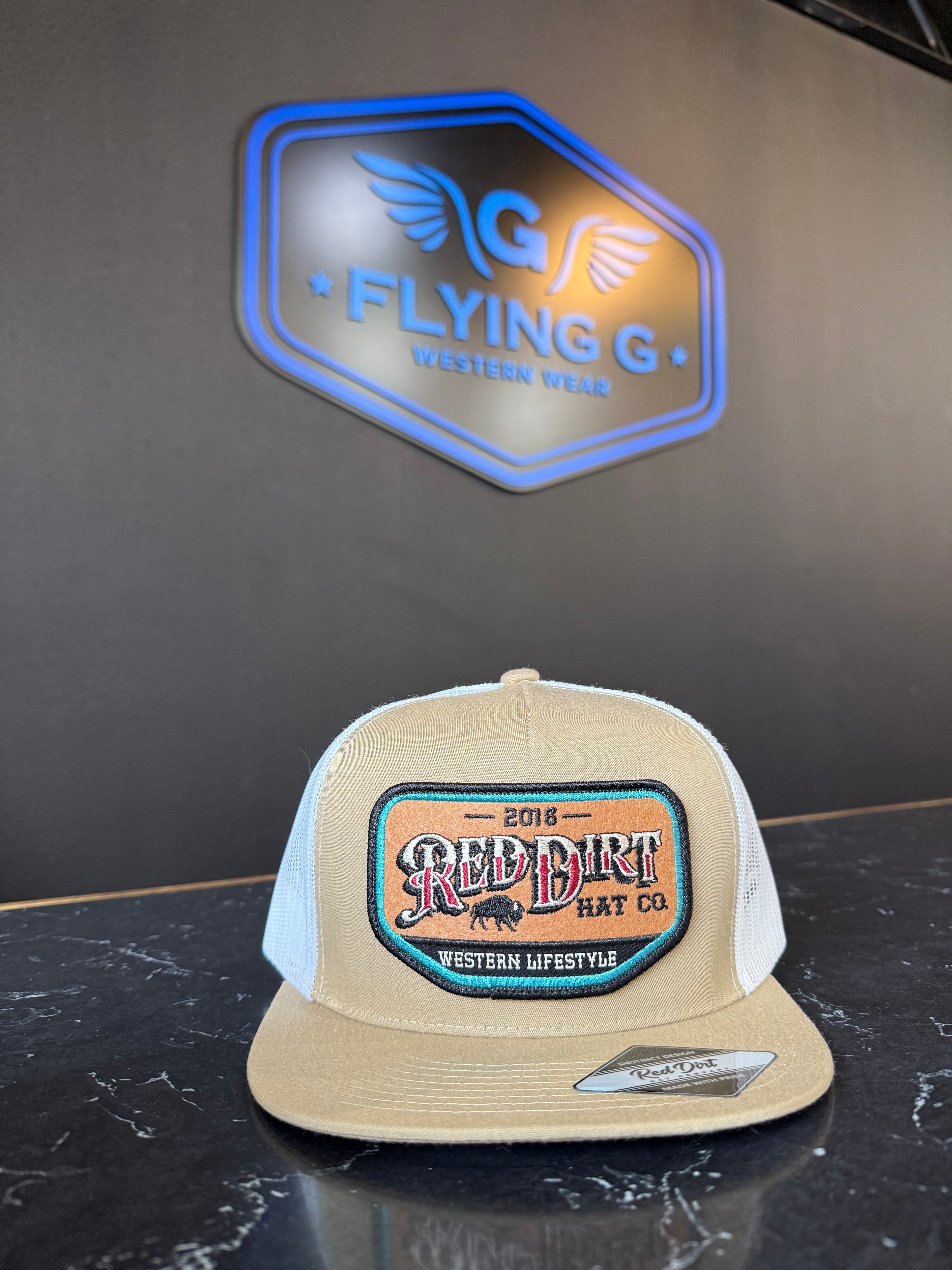 Dark tan and white red dirt cap