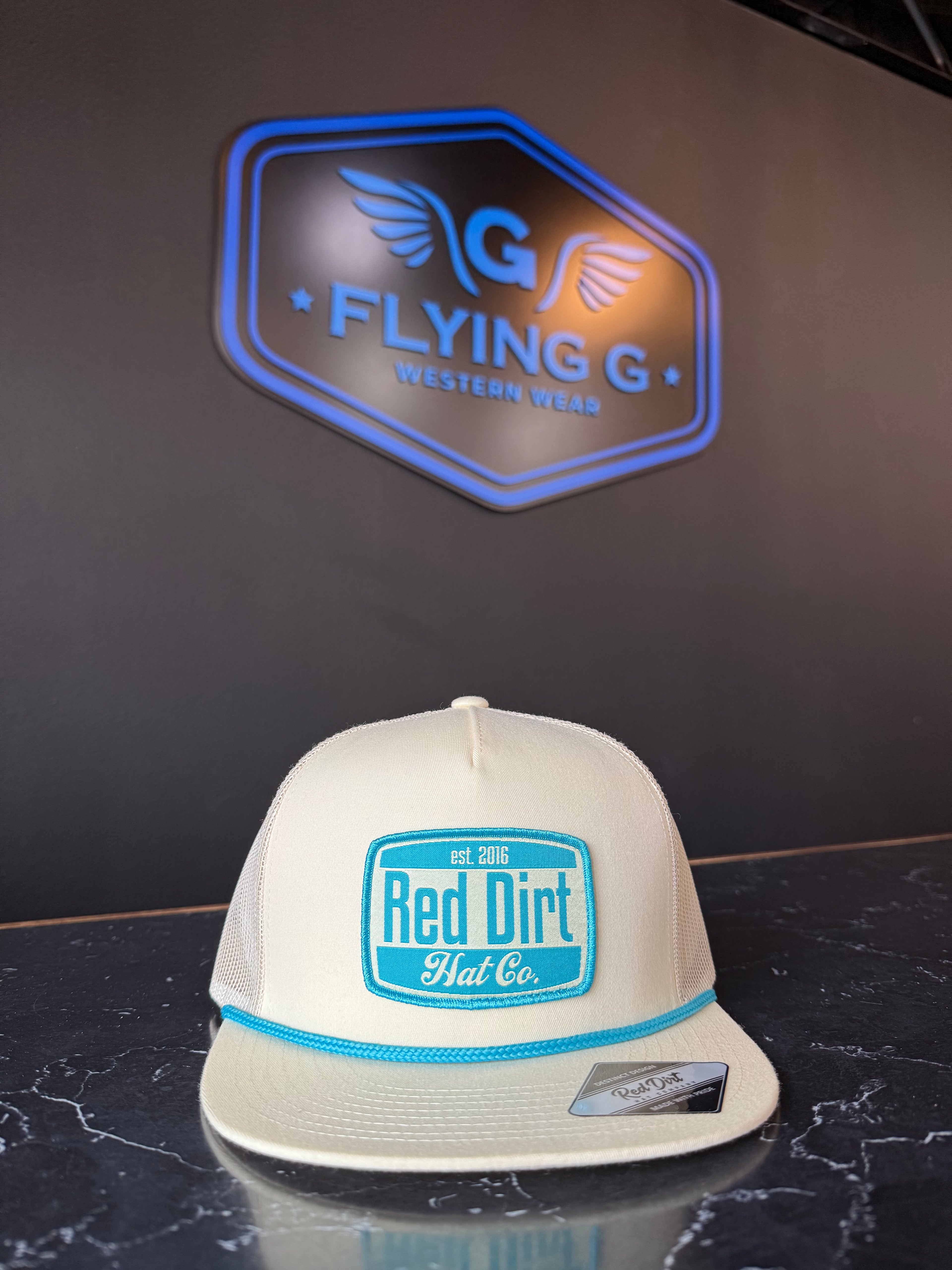 Tan and teal red dirt cap