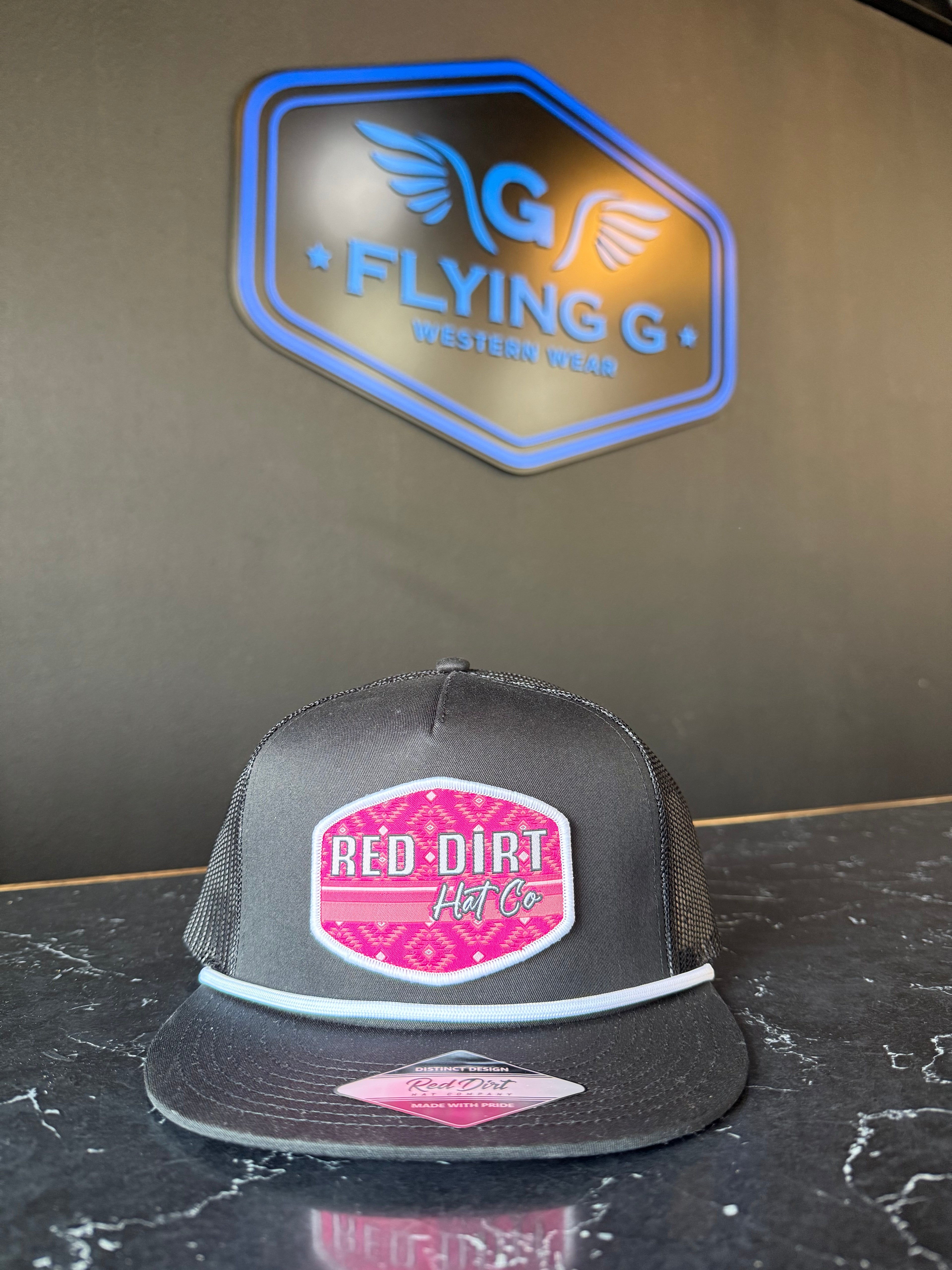 Pink and black red dirt hat