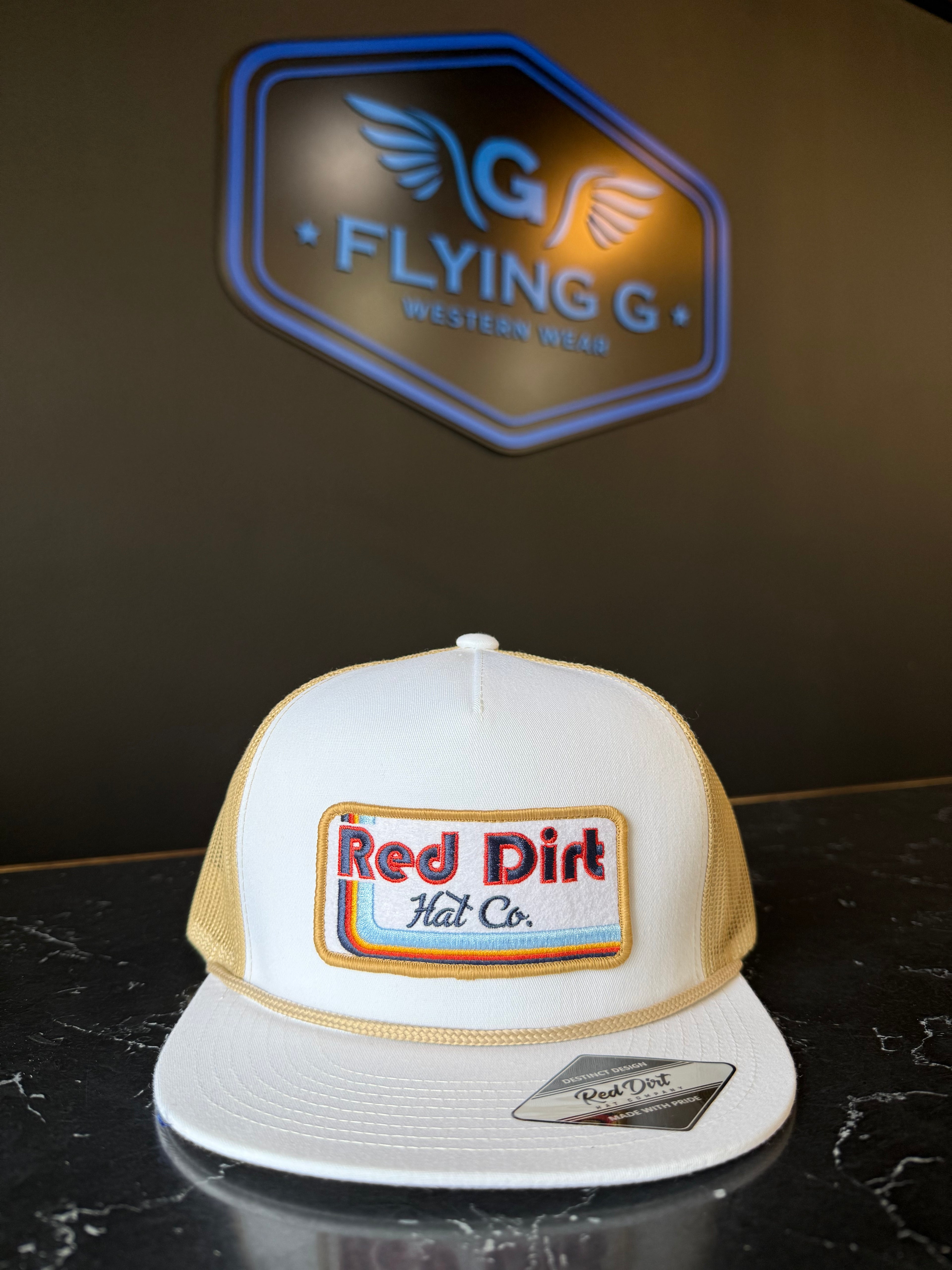 White and tan red dirt cap