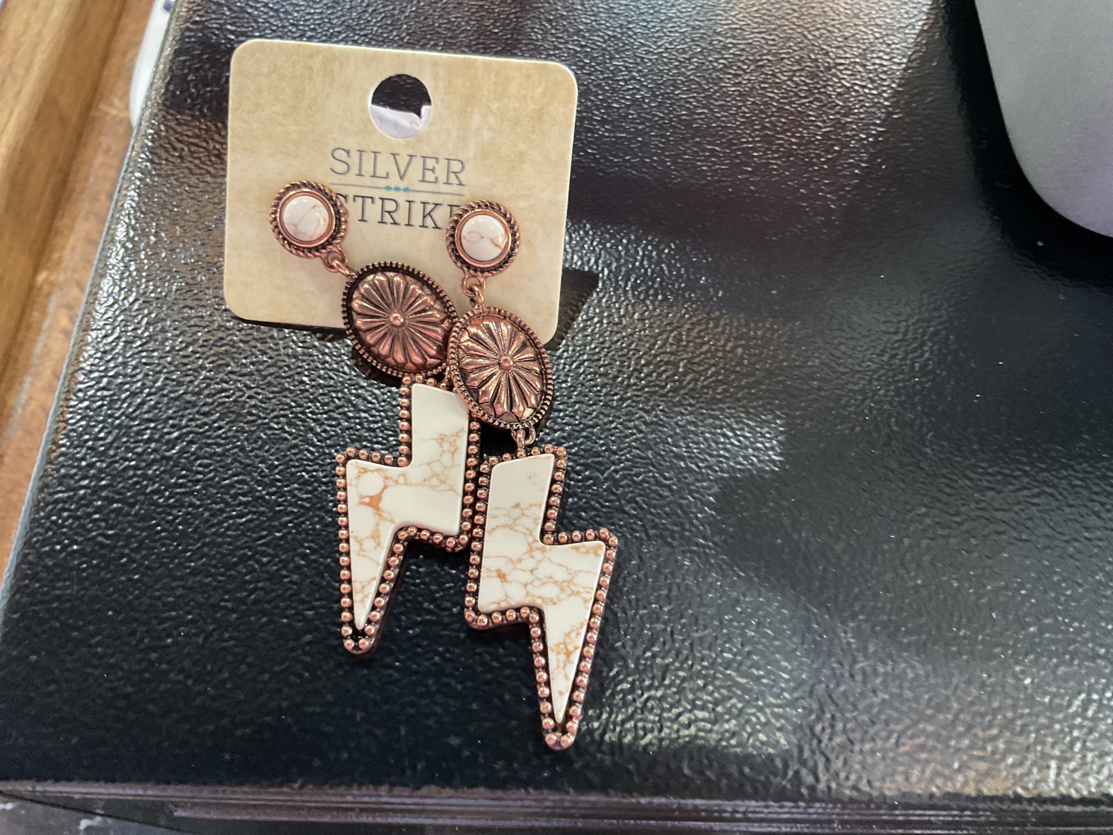 Copper and white lighting bolt earring