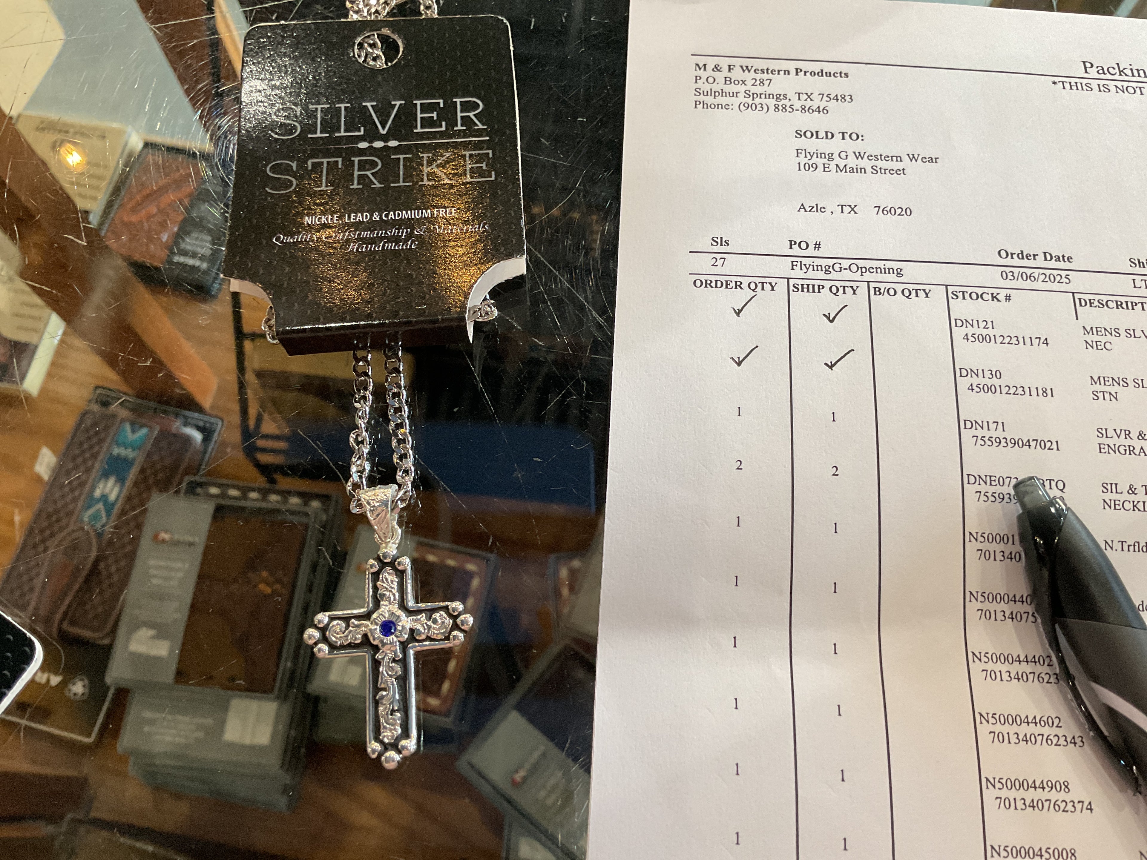SS black and silver cross with blue center stone