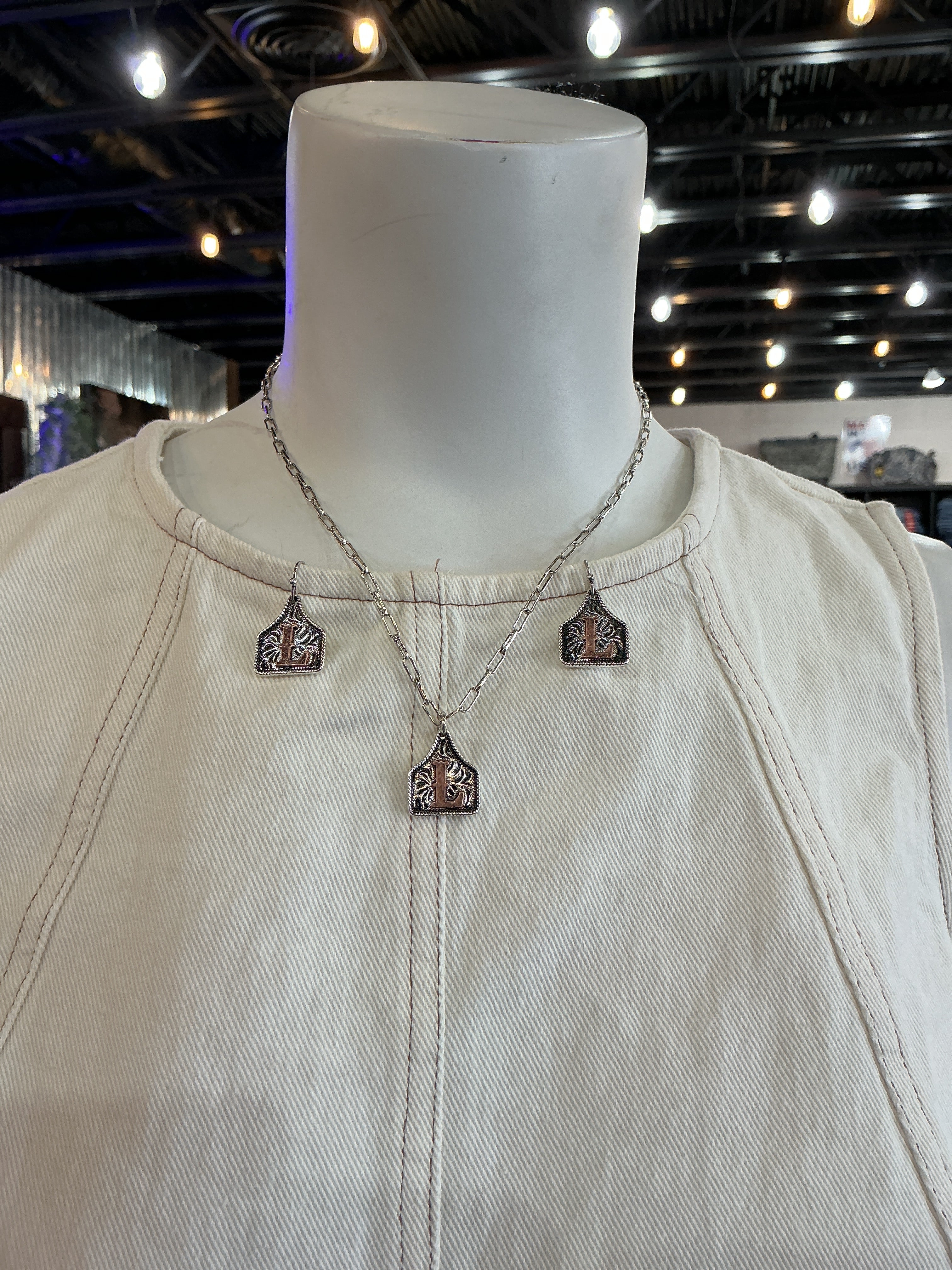 L cow tag necklace