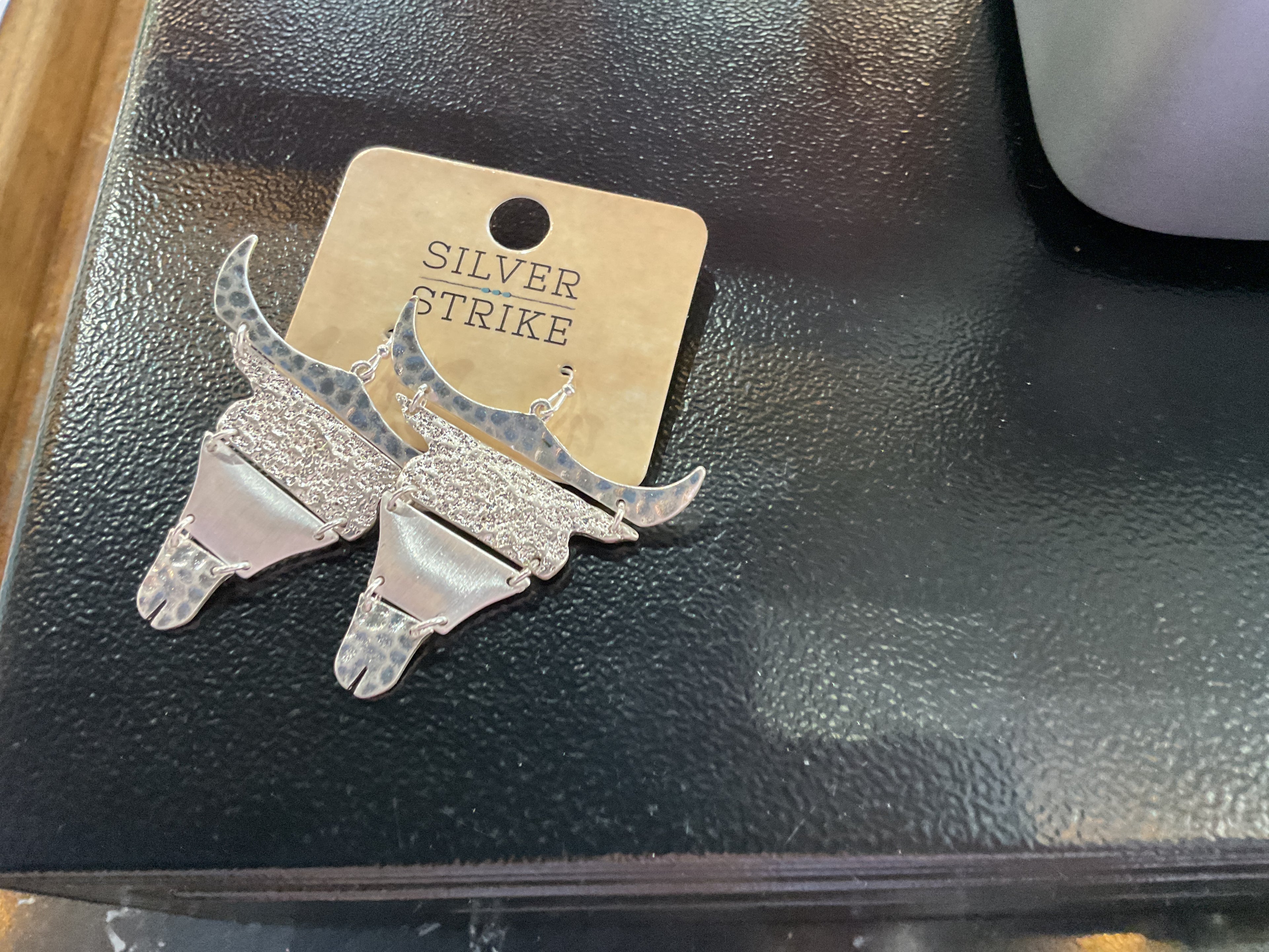 Silver hinge cow head earrings