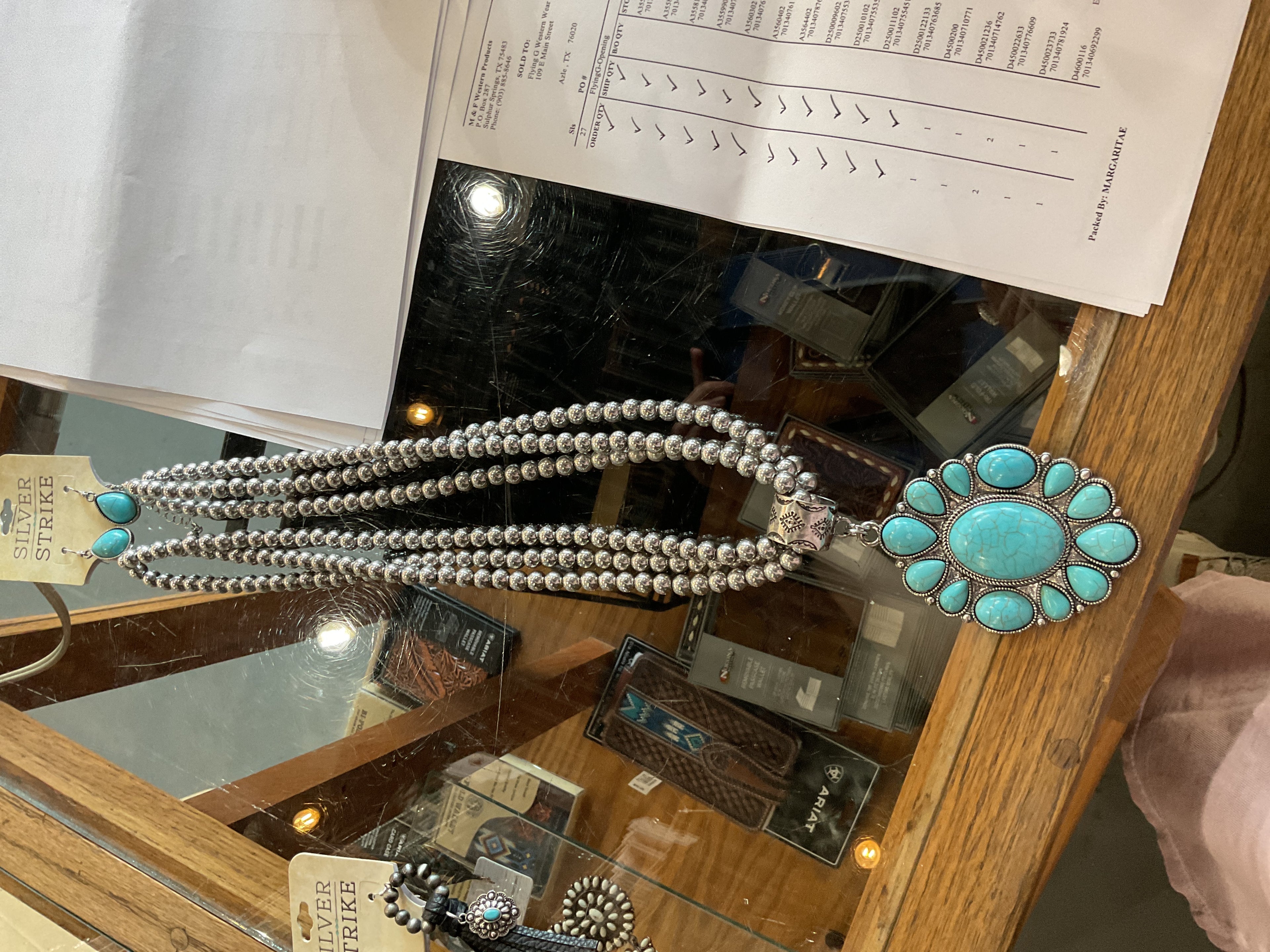 Triple strand beaded necklace with big TQ pendant