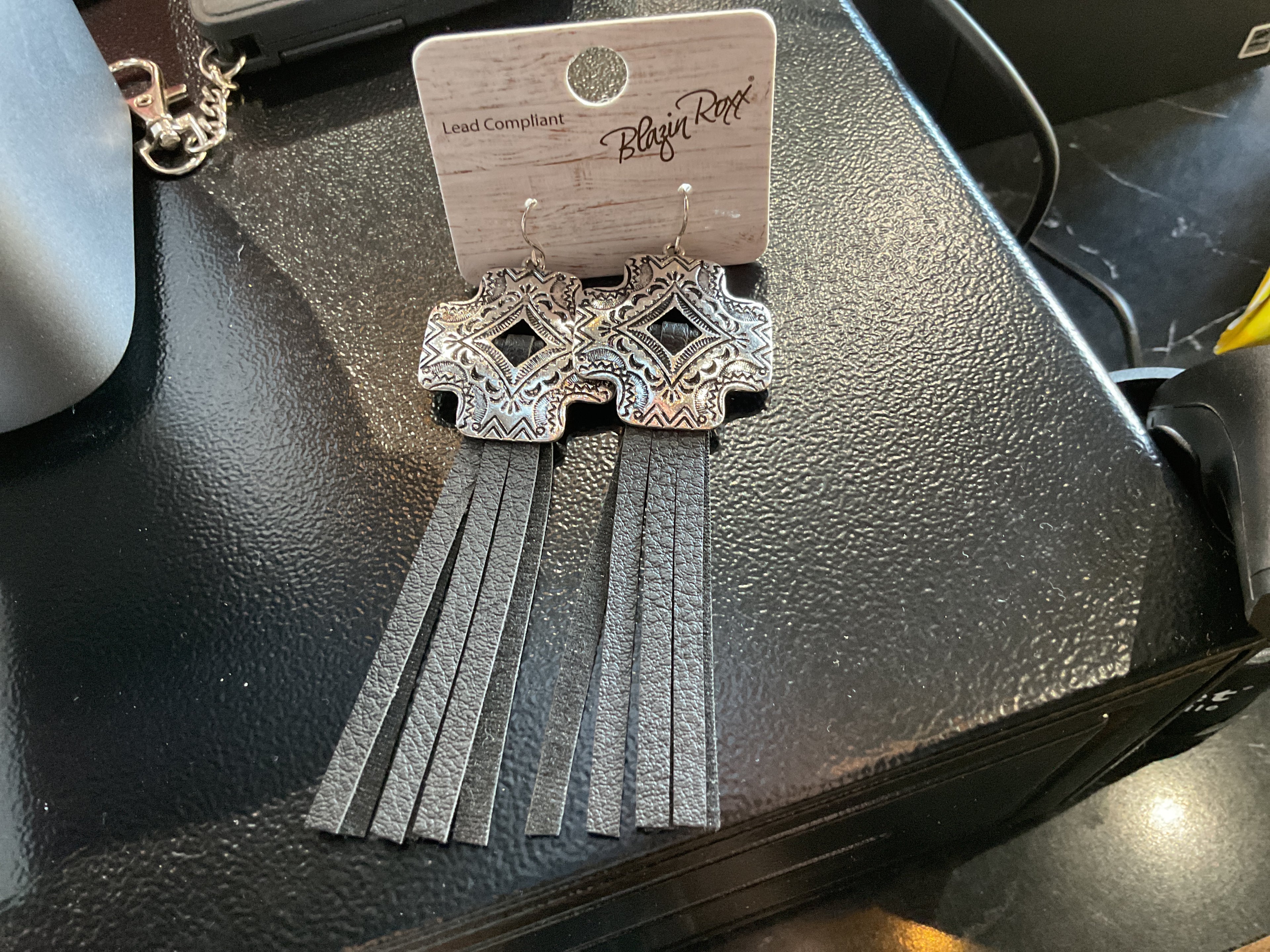 Cross earrings with leather tassels